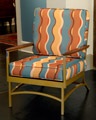 Metal armchair with wavey striped cushions